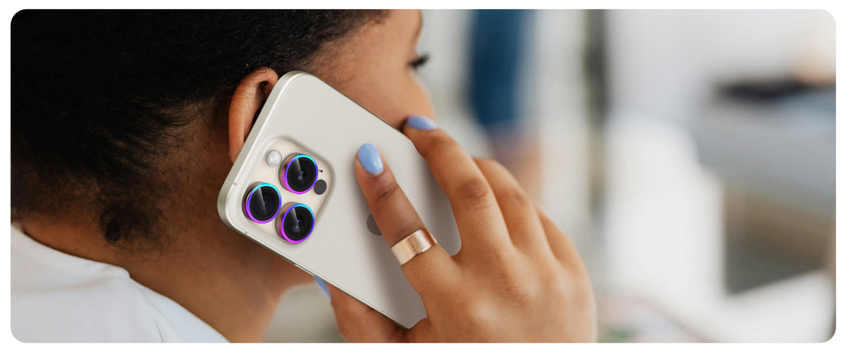 iPhone with rainbow UARMOR camera lens protector during a phone call